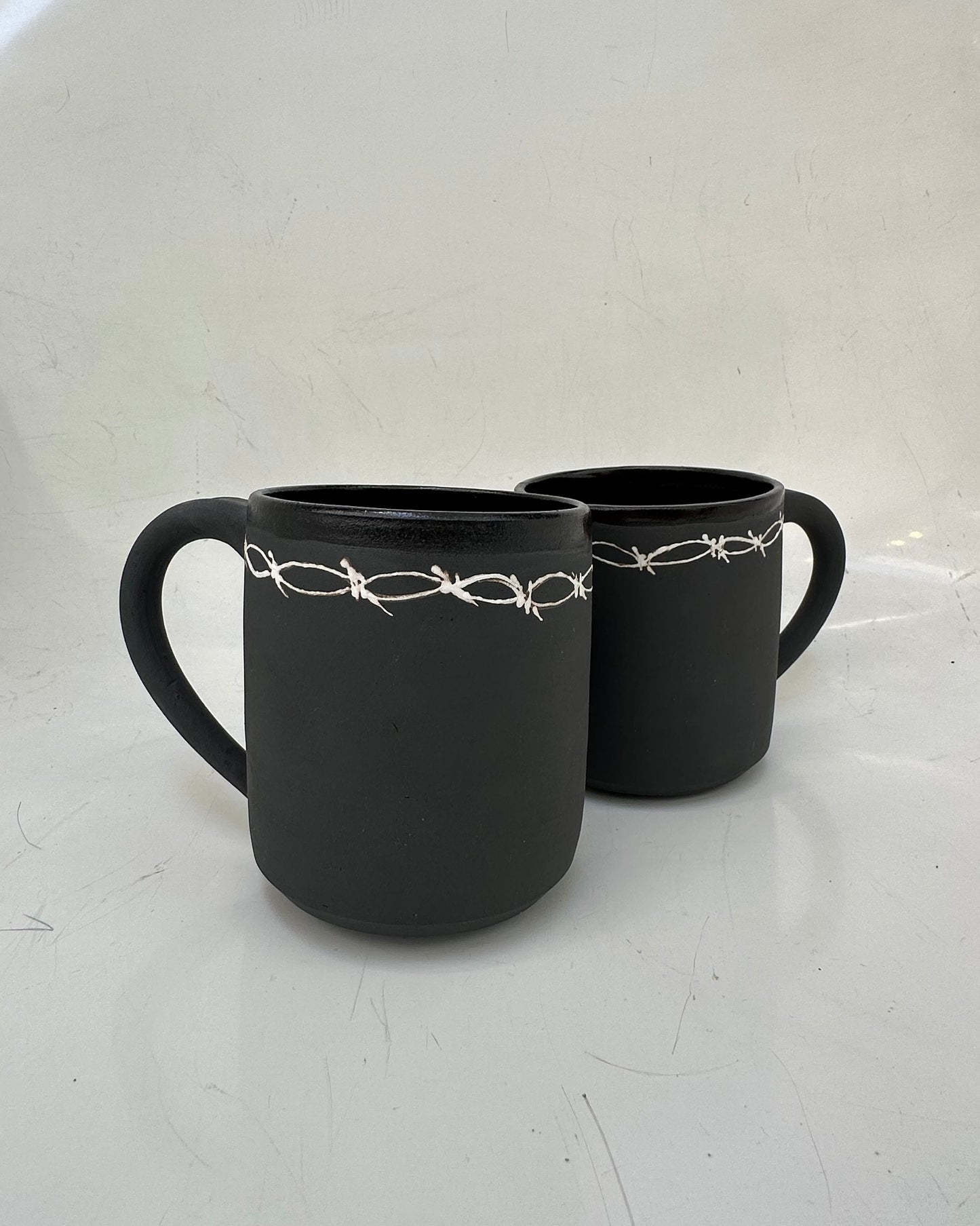 Barbed wire mug
