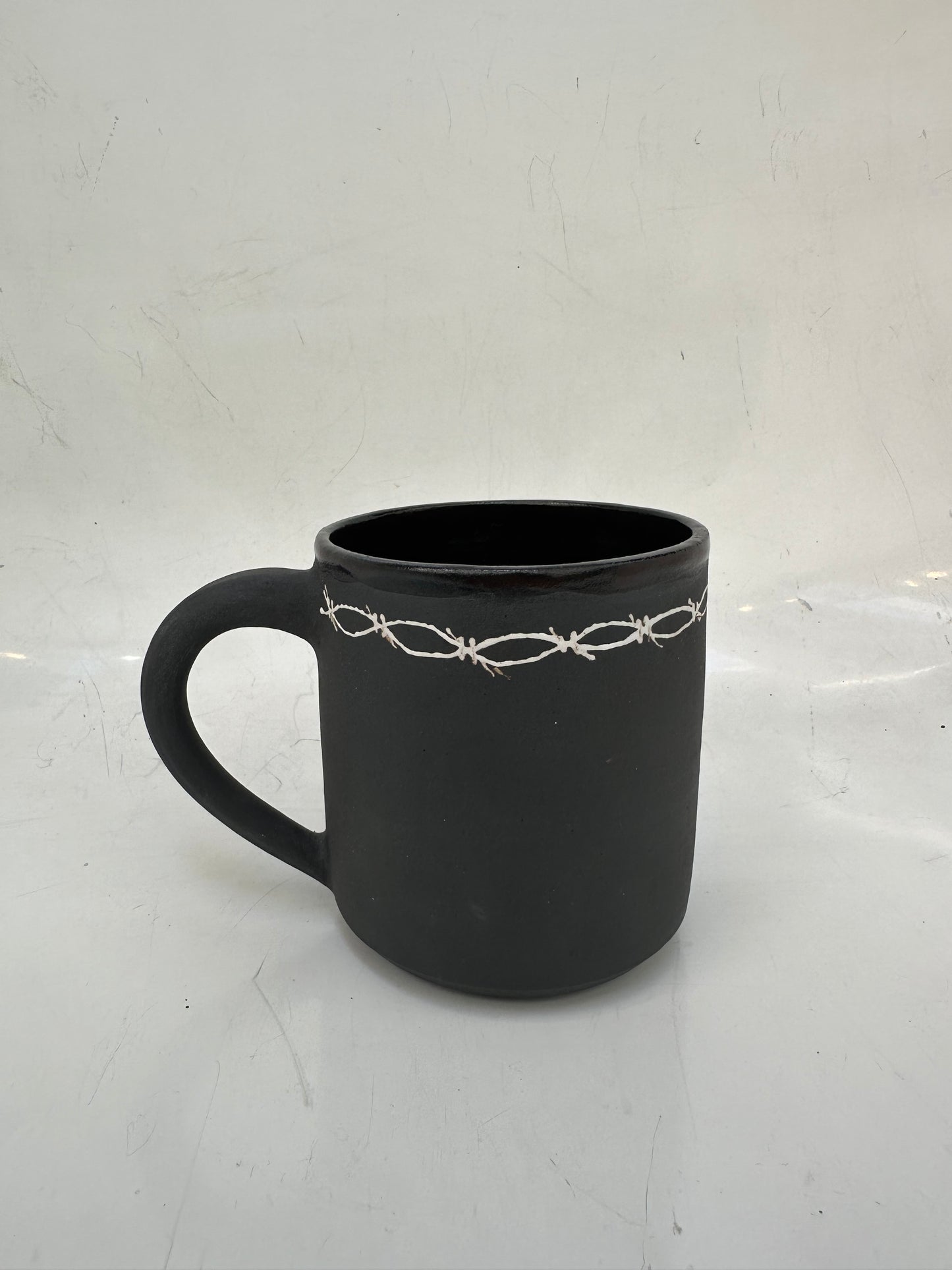 Barbed wire mug