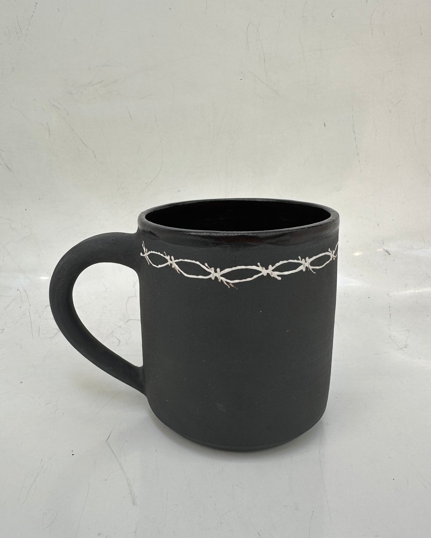 Barbed wire mug
